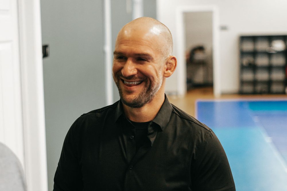 Chris Matakas smiling in the academy